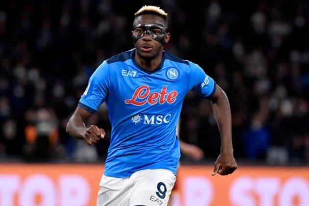 Victor Osimhen running towards the ball in a match for Napoli in their blue top on white trousers home wear